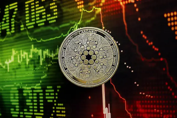 stock image KYIV, UKRAINE - AUGUST 17, 2024 Cardano ADA coin on dark cryptocurrency digital trading chart in green and red colors close up