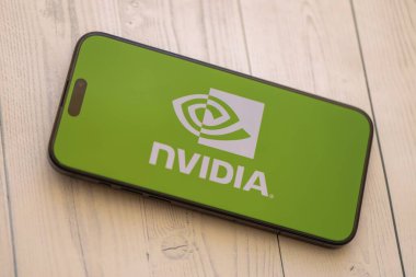 KYIV, UKRAINE - JANUARY 29, 2025 Nvidia corporation logotype showed on iPhone 15 smartphone display screen. Nvidia is a global leader in artificial intelligence hardware and software clipart