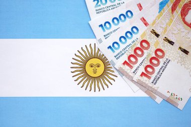 Arjantin pezosu büyük miktarda Arjantin bayrağına yakın duruyor. Finans ve bankacılık kavramı