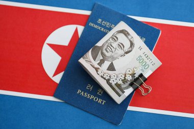 Kuzey Kore büyük miktarlarda para kazandı ve pasaport Kore Halk Cumhuriyeti bayrağına yakın duruyor. Finans ve bankacılık kavramı