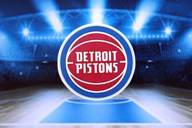 KYIV, UKRAINE - 23 Şubat 2025 Detroit Pistons basketbol takımı rozeti basketbol stadyumunun arka planında yer alıyor