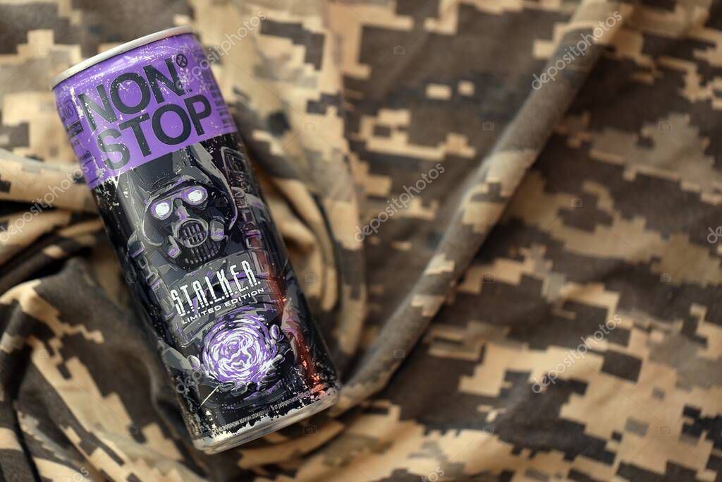 KYIV, UKRAINE - APRIL 19, 2025 Non Stop energy drink with limited edition design of Stalker and character with gas mask on purple can close up