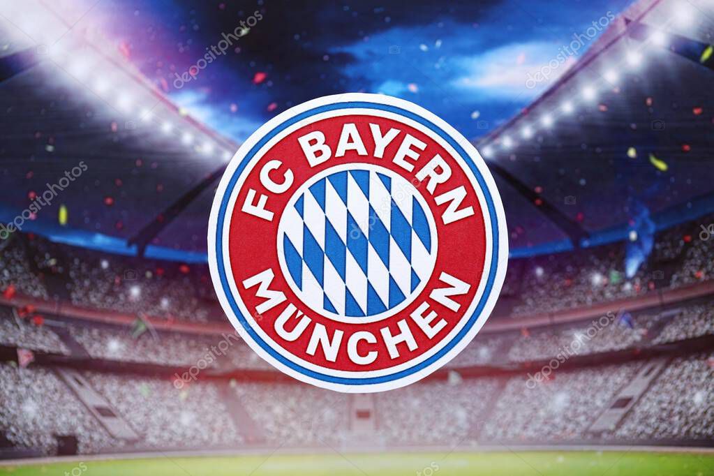 KYIV, UKRAINE - FEBRUARY 23, 2025 FC Bayern Munich football club badge lies on soccer stadium background banner