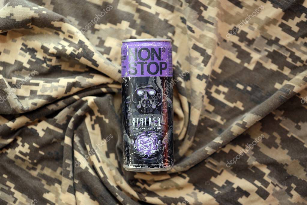 KYIV, UKRAINE - APRIL 19, 2025 Non Stop energy drink with limited edition design of Stalker and character with gas mask on purple can close up