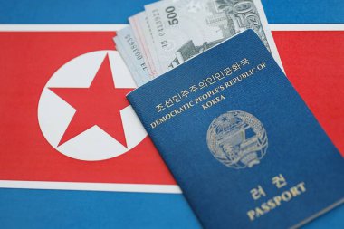 Kuzey Kore büyük miktarlarda para kazandı ve pasaport Kore Halk Cumhuriyeti bayrağına yakın duruyor. Finans ve bankacılık kavramı