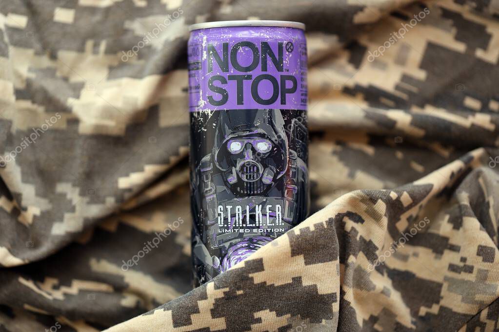 KYIV, UKRAINE - APRIL 19, 2025 Non Stop energy drink with limited edition design of Stalker and character with gas mask on purple can close up