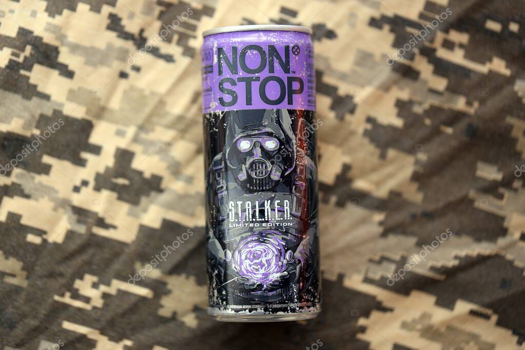KYIV, UKRAINE - APRIL 19, 2025 Non Stop energy drink with limited edition design of Stalker and character with gas mask on purple can close up