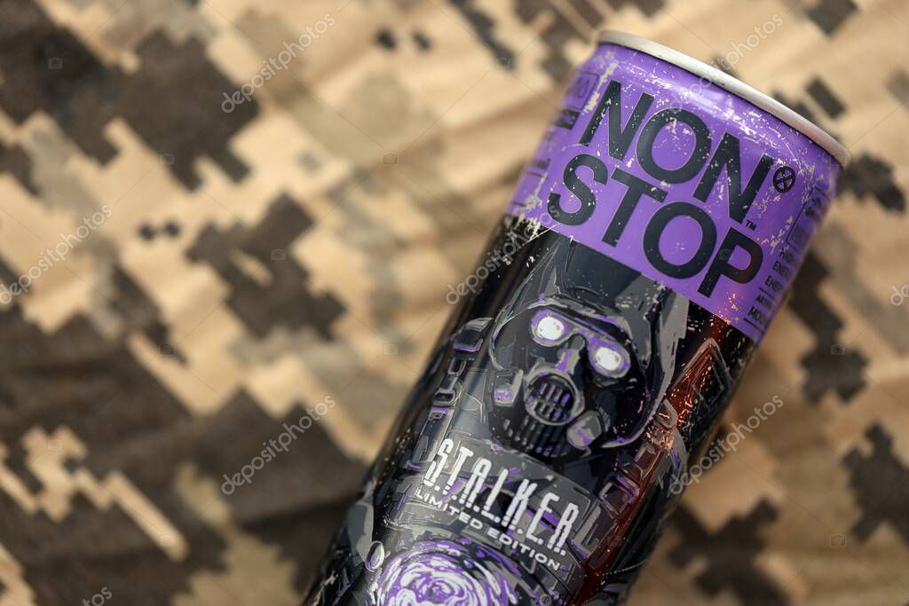 KYIV, UKRAINE - APRIL 19, 2025 Non Stop energy drink with limited edition design of Stalker and character with gas mask on purple can close up