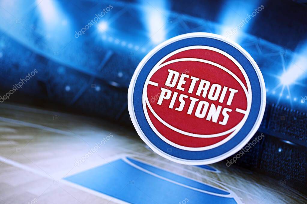 KYIV, UKRAINE - FEBRUARY 23, 2025 Detroit Pistons basketball team badge lies on basketball stadium background banner