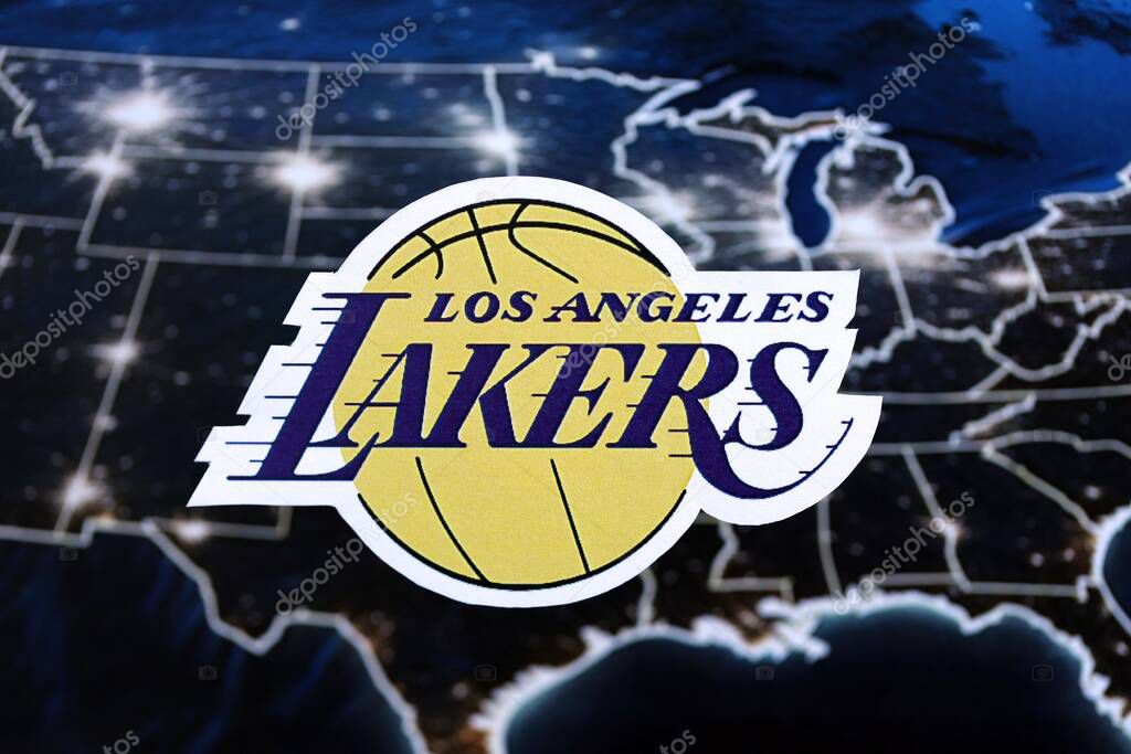 KYIV, UKRAINE - FEBRUARY 23, 2025 Los Angeles Lakers basketball team badge lies on United States map background banner