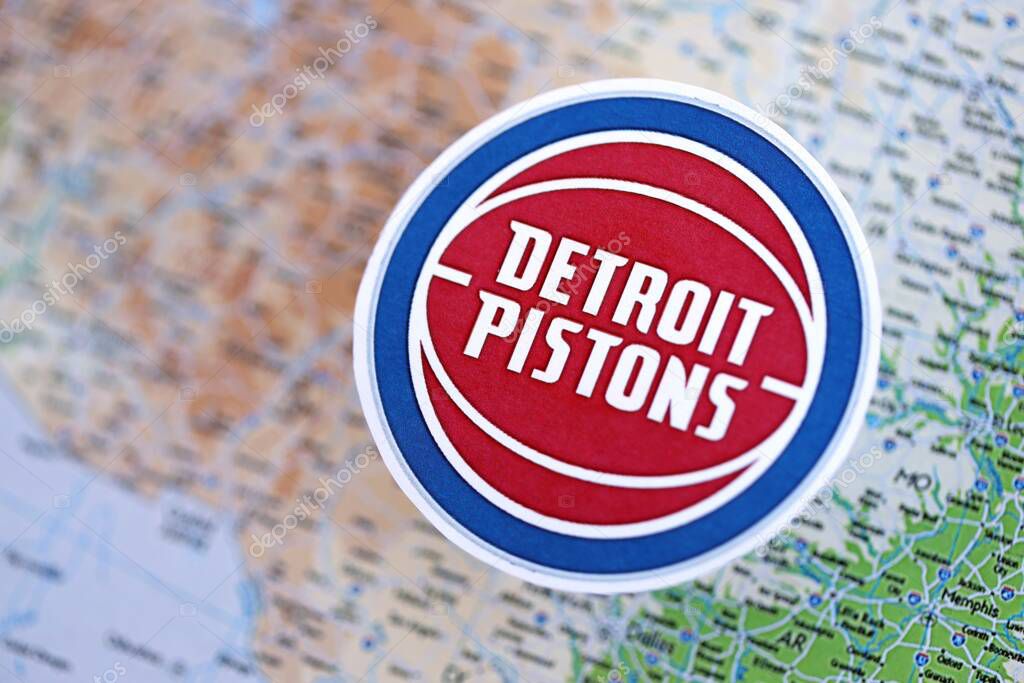 KYIV, UKRAINE - FEBRUARY 23, 2025 Detroit Pistons basketball team badge lies on USA map background banner