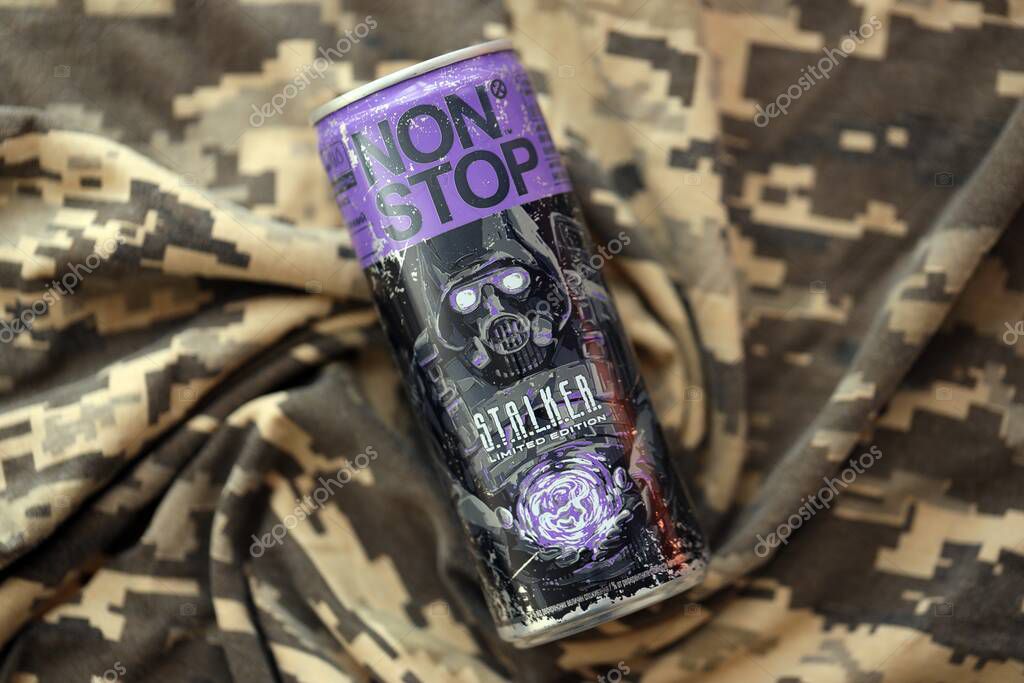 KYIV, UKRAINE - APRIL 19, 2025 Non Stop energy drink with limited edition design of Stalker and character with gas mask on purple can close up
