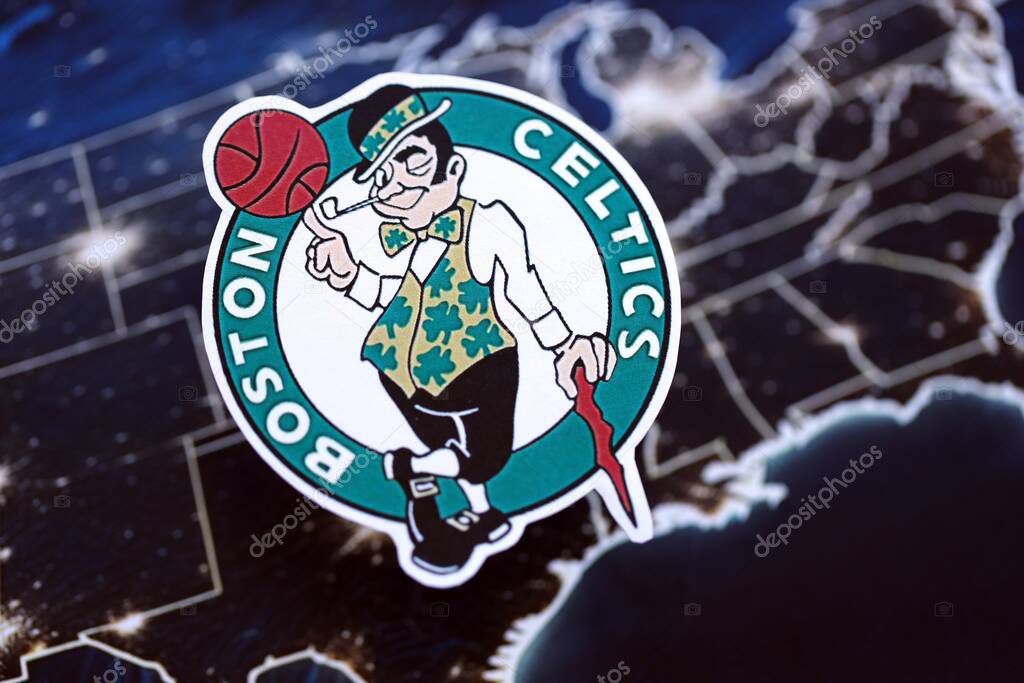 KYIV, UKRAINE - FEBRUARY 23, 2025 Boston Celtics basketball team badge lies on United States map background banner