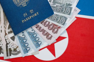 Kuzey Kore büyük miktarlarda para kazandı ve pasaport Kore Halk Cumhuriyeti bayrağına yakın duruyor. Finans ve bankacılık kavramı