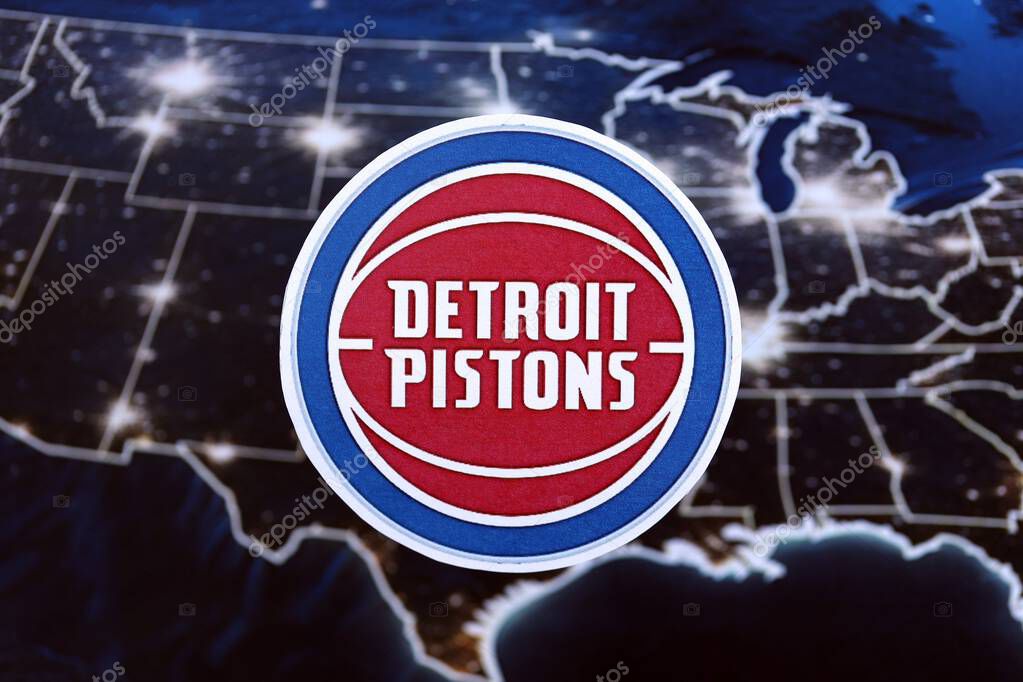 KYIV, UKRAINE - FEBRUARY 23, 2025 Detroit Pistons basketball team badge lies on United States map background banner
