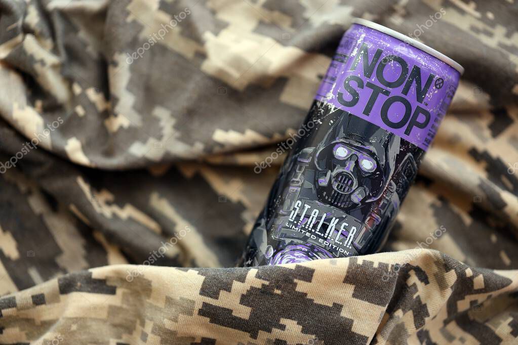 KYIV, UKRAINE - APRIL 19, 2025 Non Stop energy drink with limited edition design of Stalker and character with gas mask on purple can close up