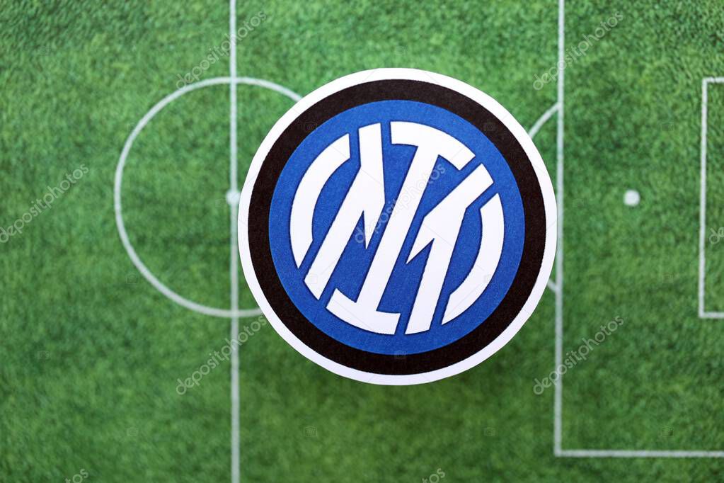 KYIV, UKRAINE - FEBRUARY 23, 2025 Inter Milan FC football club badge lies on soccer field background banner