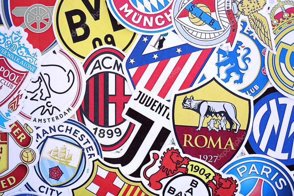 KYIV, UKRAINE - FEBRUARY 23, 2025 Many paper emblems of football clubs lies in big pile close up
