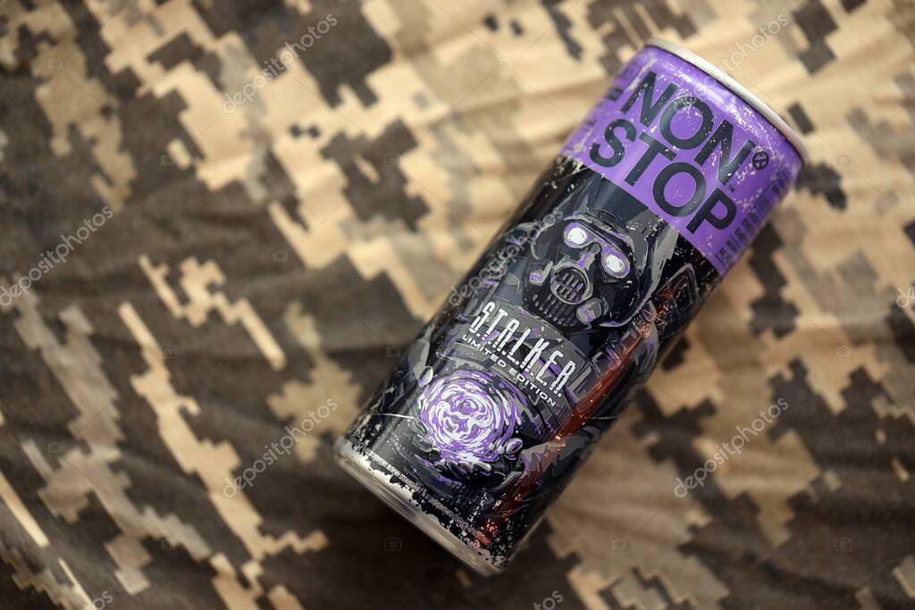 KYIV, UKRAINE - APRIL 19, 2025 Non Stop energy drink with limited edition design of Stalker and character with gas mask on purple can close up