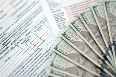 Birleşik Devletler dolarlarının büyük bir kısmı bireysel gelir vergisi iadesi formlarıyla masaya yatırıldı. ABD 'de vergilendirme ve muhasebe kavramı