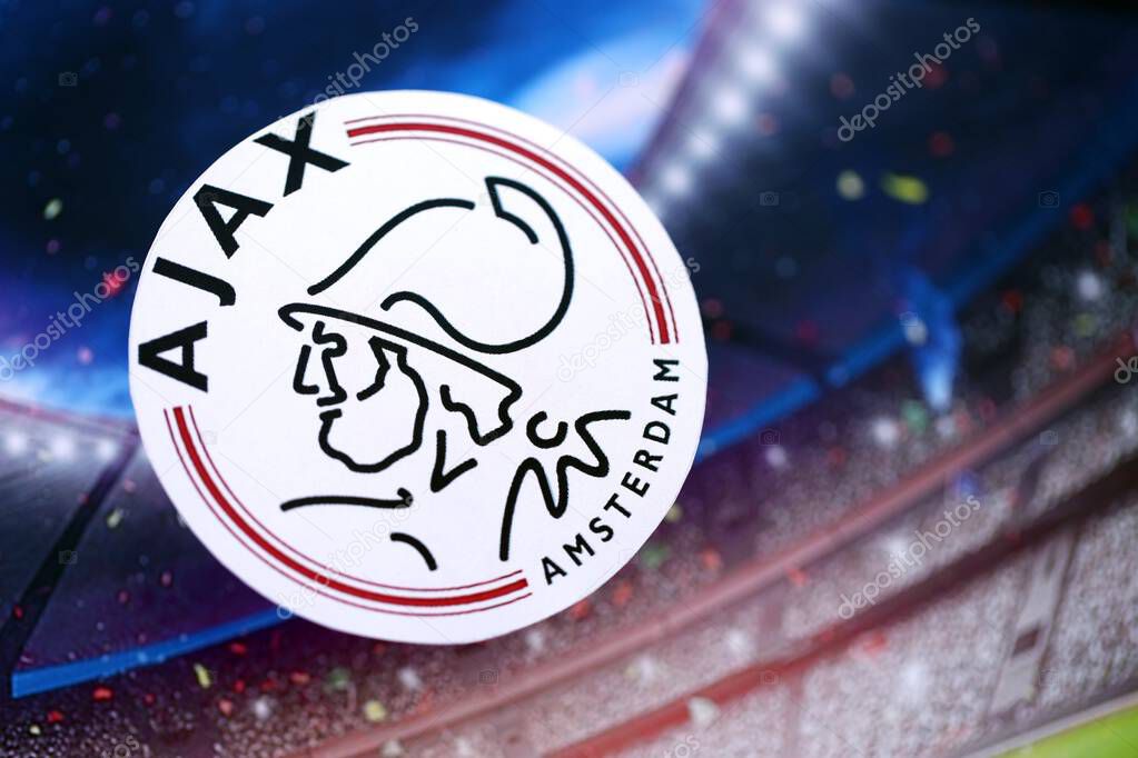 KYIV, UKRAINE - FEBRUARY 23, 2025 AFC Ajax football club badge lies on soccer stadium background banner