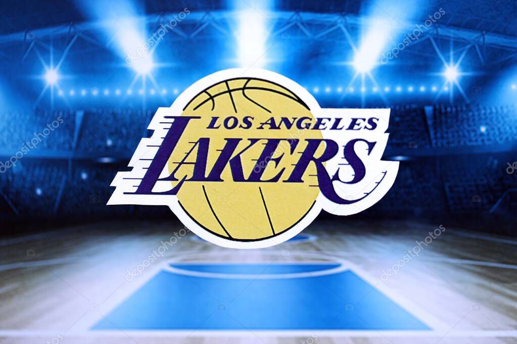 KYIV, UKRAINE - FEBRUARY 23, 2025 Los Angeles Lakers basketball team badge lies on basketball stadium background banner