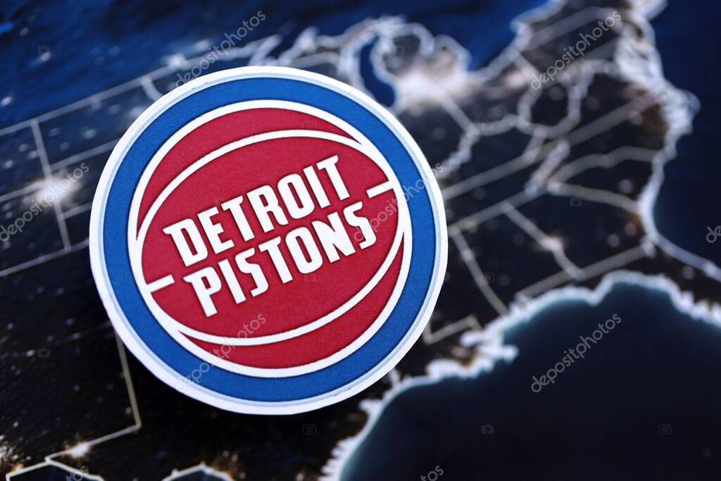 KYIV, UKRAINE - FEBRUARY 23, 2025 Detroit Pistons basketball team badge lies on United States map background banner