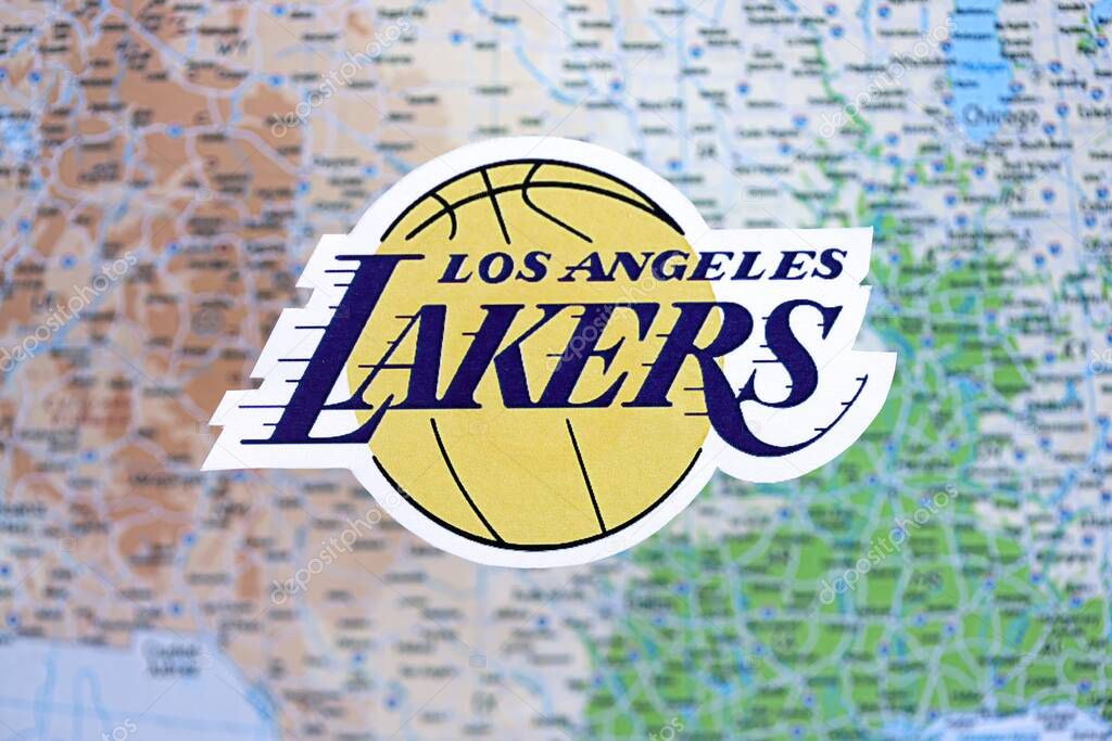 KYIV, UKRAINE - FEBRUARY 23, 2025 Los Angeles Lakers basketball team badge lies on USA map background banner