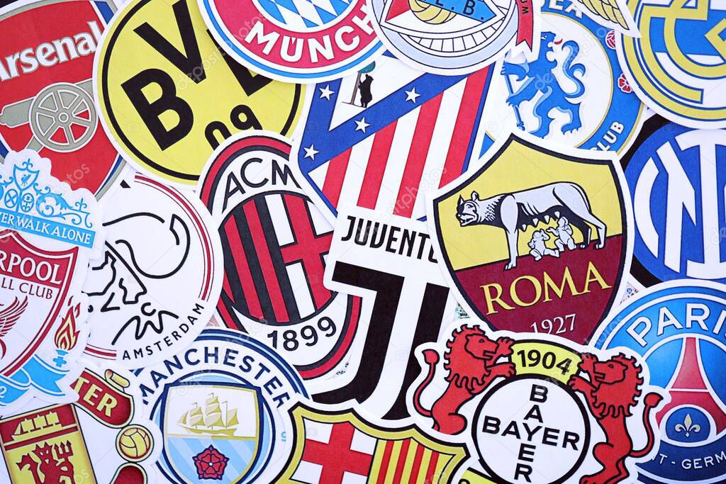 KYIV, UKRAINE - FEBRUARY 23, 2025 Many paper emblems of football clubs lies in big pile close up