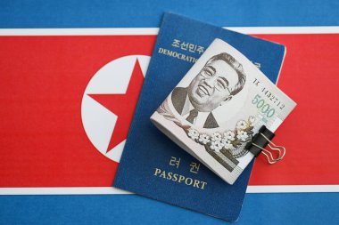 Kuzey Kore büyük miktarlarda para kazandı ve pasaport Kore Halk Cumhuriyeti bayrağına yakın duruyor. Finans ve bankacılık kavramı