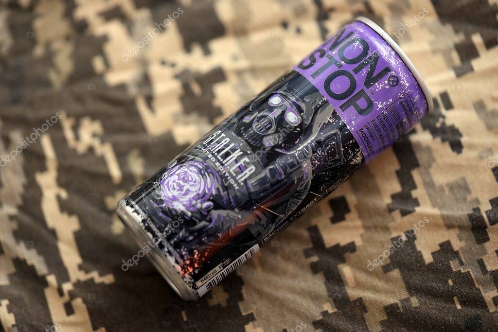 KYIV, UKRAINE - APRIL 19, 2025 Non Stop energy drink with limited edition design of Stalker and character with gas mask on purple can close up