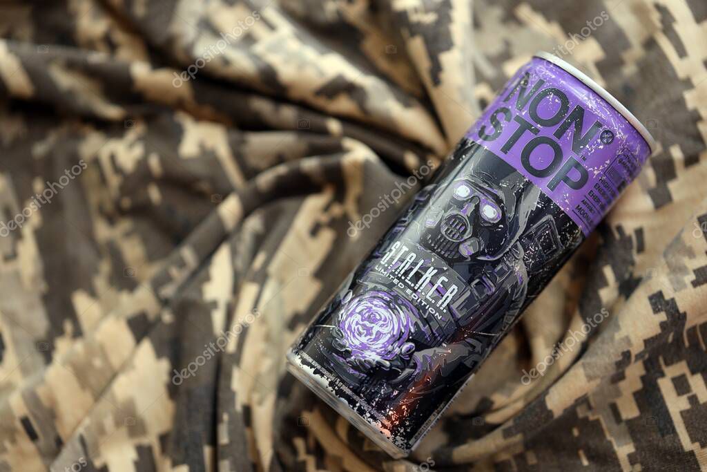 KYIV, UKRAINE - APRIL 19, 2025 Non Stop energy drink with limited edition design of Stalker and character with gas mask on purple can close up