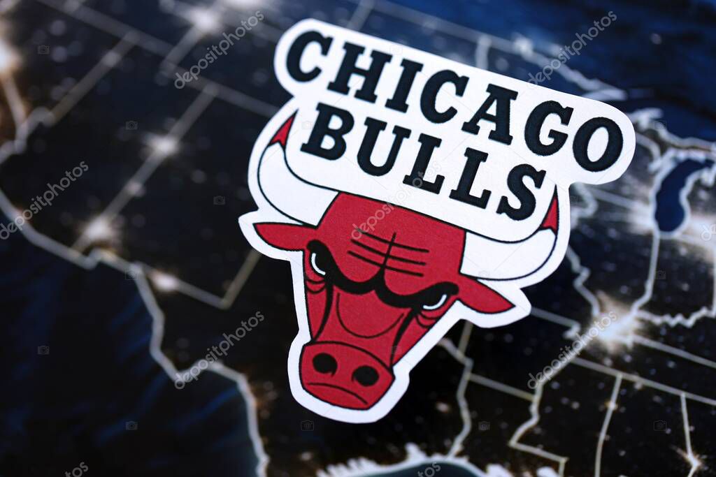 KYIV, UKRAINE - FEBRUARY 23, 2025 Chicago Bulls basketball team badge lies on United States map background banner