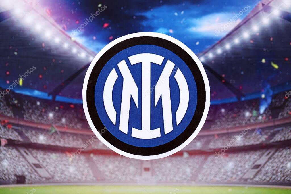 KYIV, UKRAINE - FEBRUARY 23, 2025 Inter Milan FC football club badge lies on soccer stadium background banner