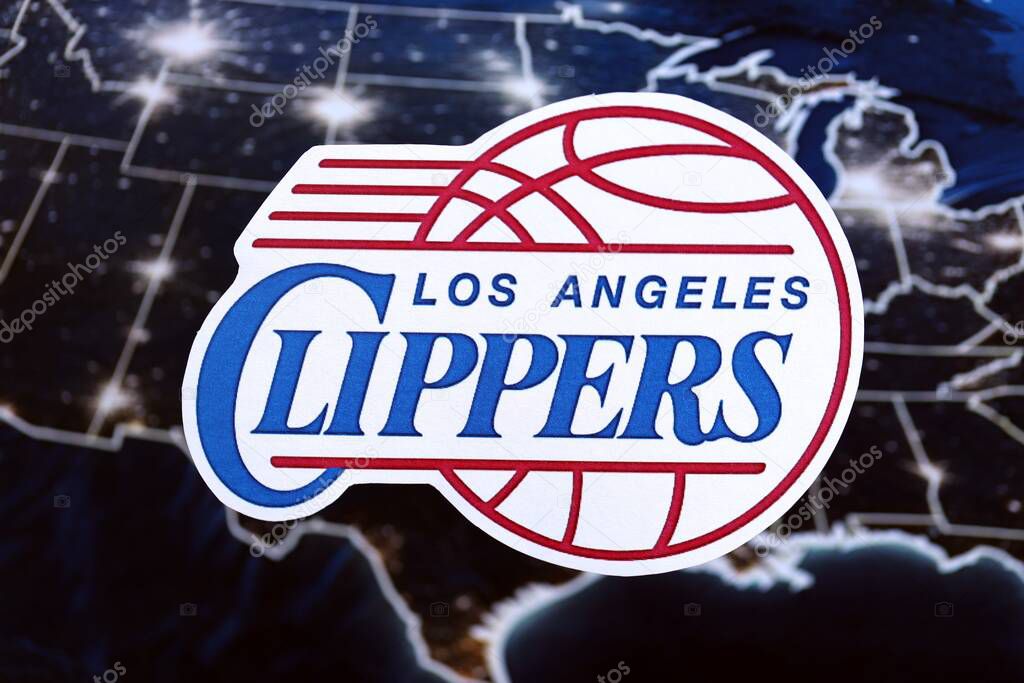 KYIV, UKRAINE - FEBRUARY 23, 2025 Los Angeles Clippers basketball team badge lies on United States map background banner