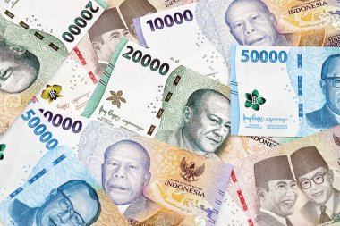 KYIV, UKRAINE - 27 Ocak 2024 Birçok Endonezya rupia para serisinin arkaplan resmi