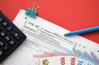 KYIV, UKRAINE - JANUARY 27, 2024 Indonesian tax form 1770-4 Individual Income Tax Return and pen on table close up