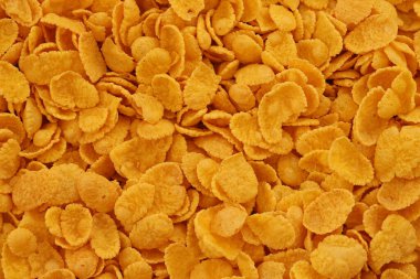 Mısır gevreği dokusu yakından geliyor. Sabah kahvaltısı için mısır gevreği kutusu.