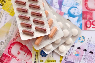 Filipinler para birimi faturaları ve ilaç hapları kapanıyor. İlaç ve eczane kavramı