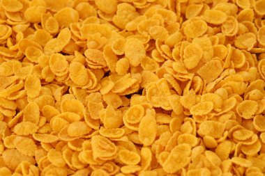 Mısır gevreği arkaplanı ve dokuyu kapatır. Sabah kahvaltısı için mısır gevreği kutusu.