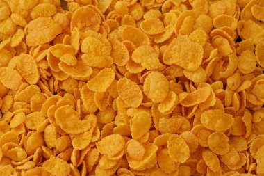 Mısır gevreği arkaplanı ve dokuyu kapatır. Sabah kahvaltısı için mısır gevreği kutusu.