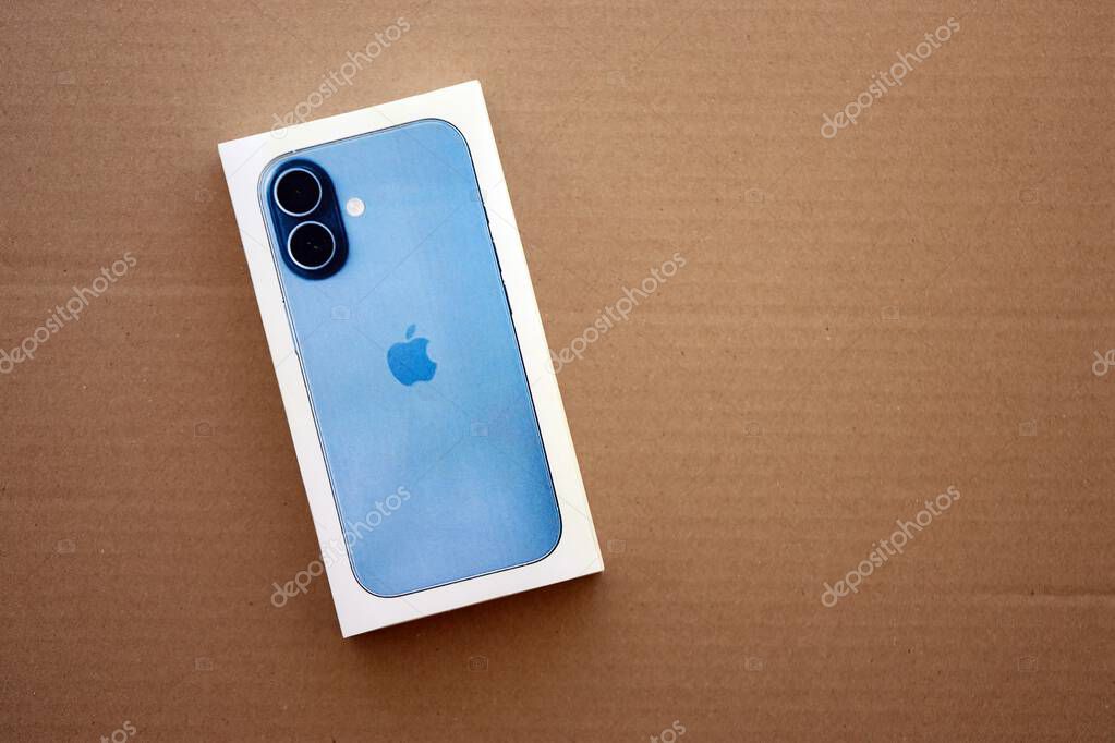 KYIV, UKRAINE - SEPTEMBER 21, 2025 Apple iPhone 17 Mist Blue box on cardboard surface close up