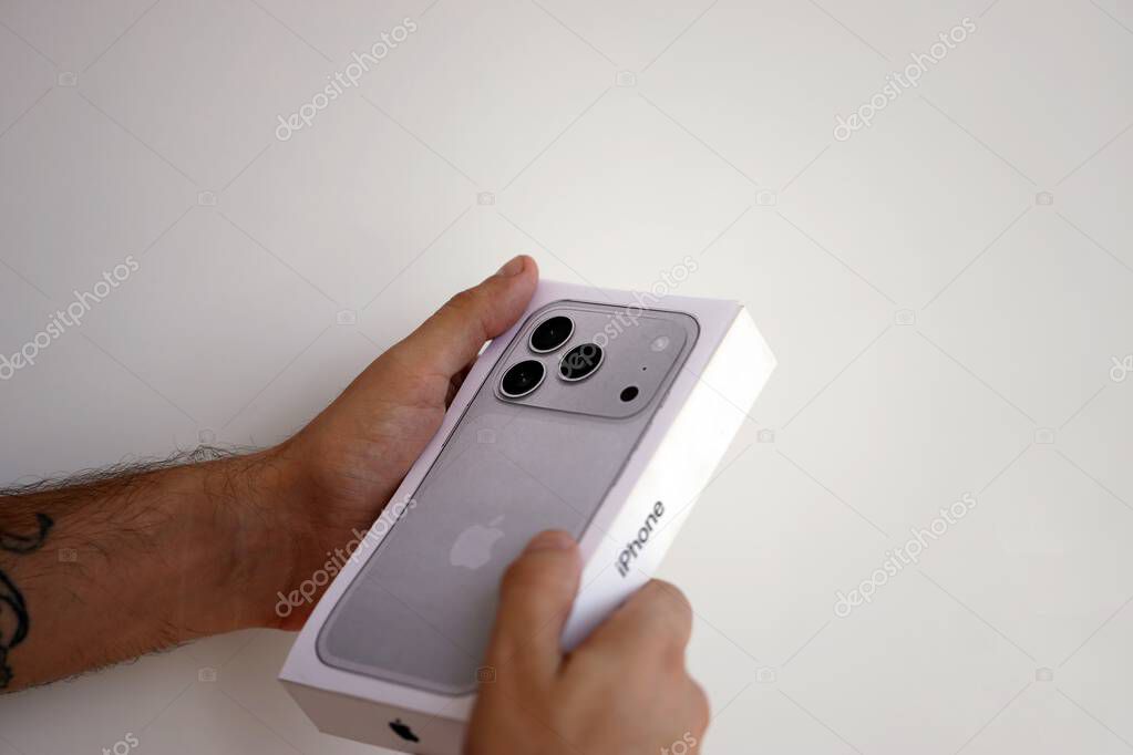 KYIV, UKRAINE - SEPTEMBER 21, 2025 Apple iPhone 17 Pro Max Silver box in male hands in shop close up