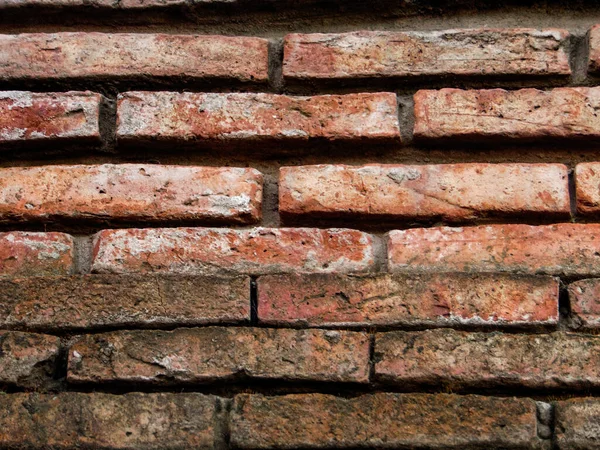 Yıpranmış tuğla duvar desenli kumlu