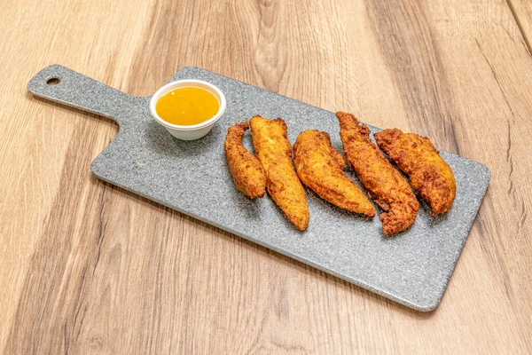 Crispy Fried Battered Chicken Tenderloins with a Sweet Curry Sauce for Dipping