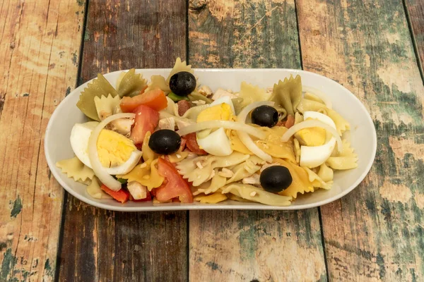 pasta salad whose main ingredient is cooked pasta, which is usually accompanied by finely cut vegetables in a vinaigrette