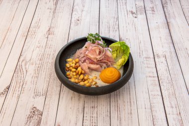 Ceviche is prepared with onion, sweet chili and cilantro castilla. Varieties of fish such as marlin, tilapia or corvina are commonly used and in addition to lemon juice