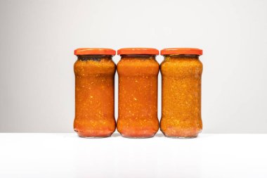 Glass jars of canned tomato sauce for pasta