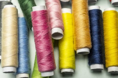 Brand new spools of various colored sewing thread