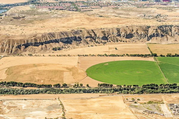 stock image Aerial image of agricultural fields and a housing development in the background